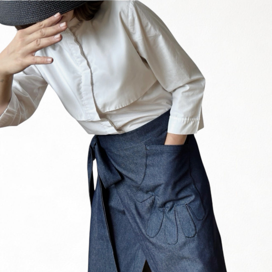Denim wrap skirt with hand shaped appliqué pocket