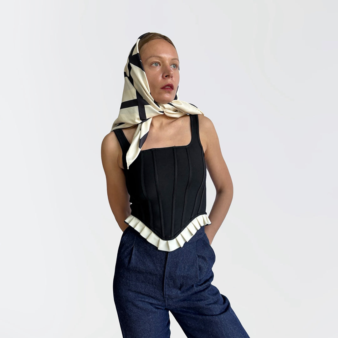 Black rib knit corset top with ruffle