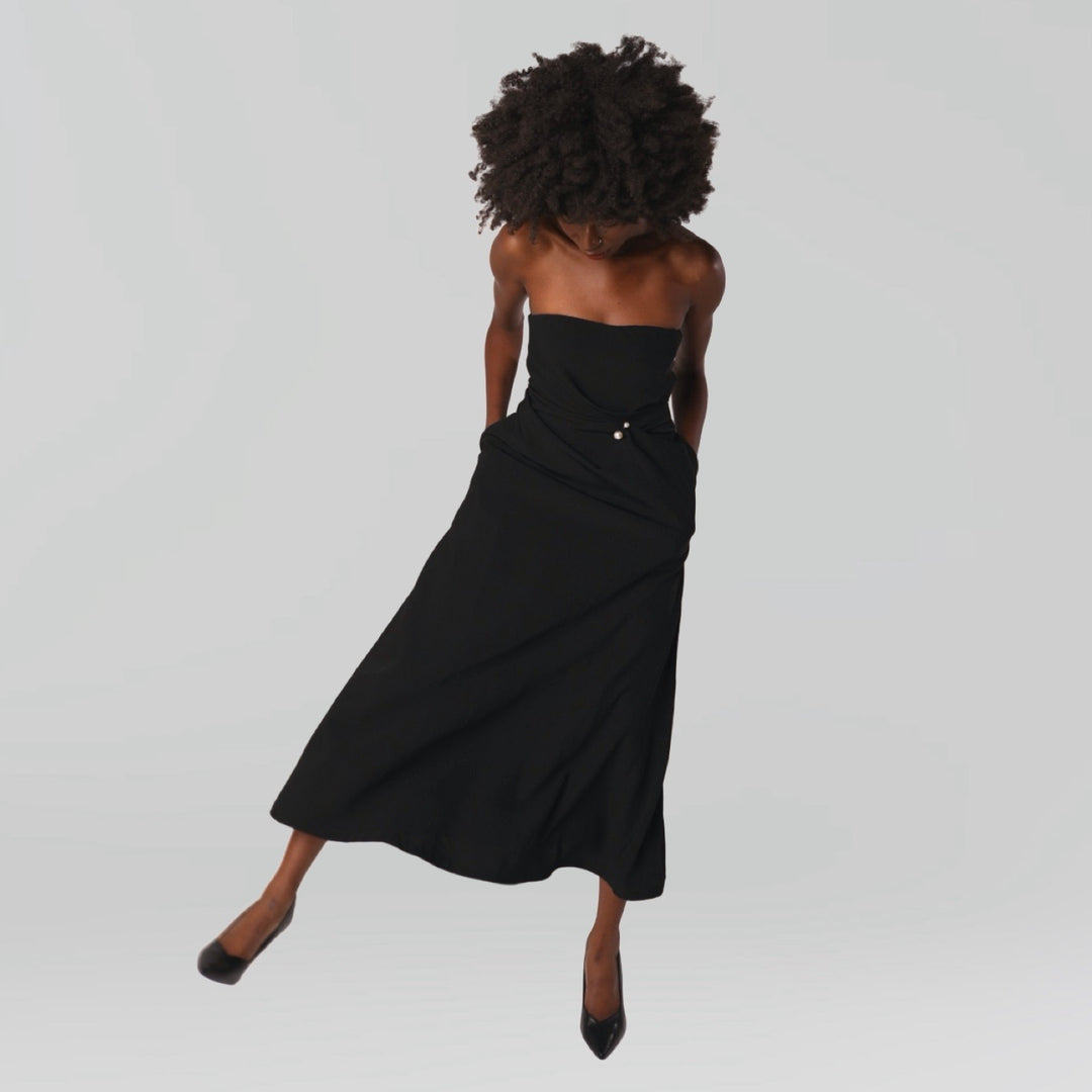 Black strapless dress with asymmetrical folds and pearl detail