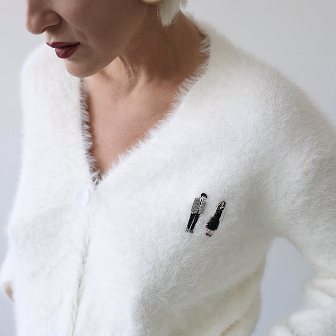 Beige fuzzy knit cardigan with embroidery patchess