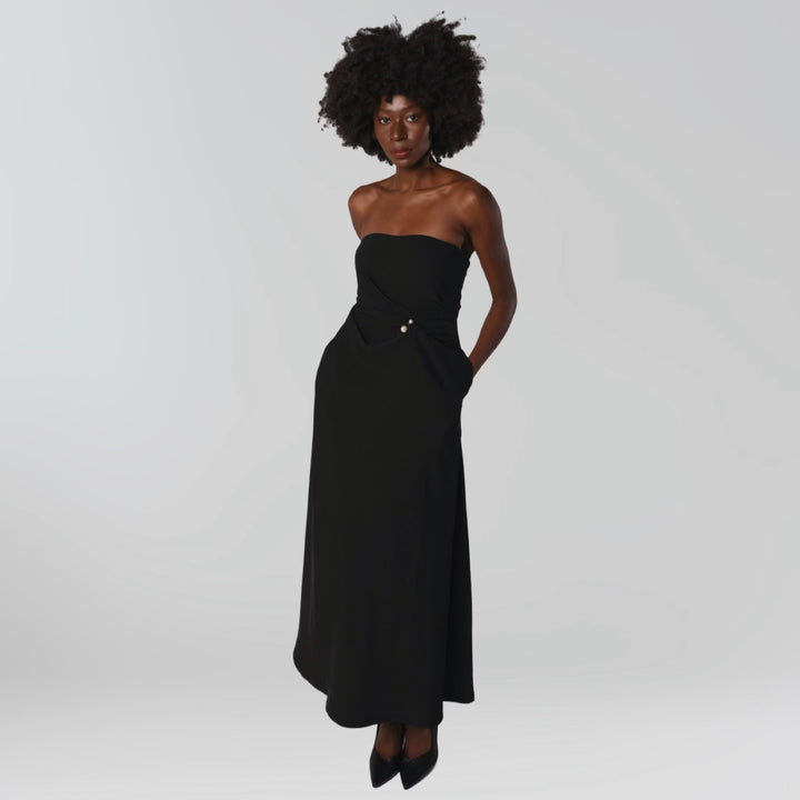 Black strapless dress with asymmetrical folds and pearl detail