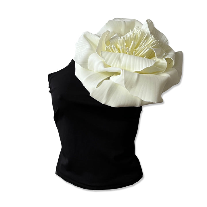 Black one shoulder top with white flower pin