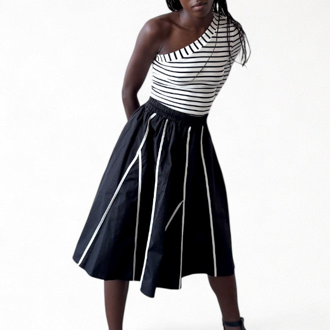 Black skirt with panels and white contrast tape