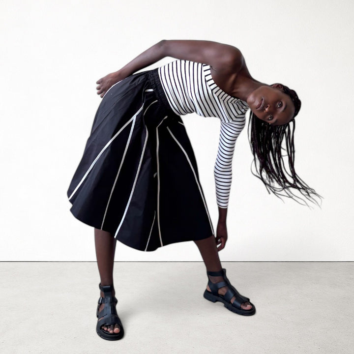 Black skirt with panels and white contrast tape