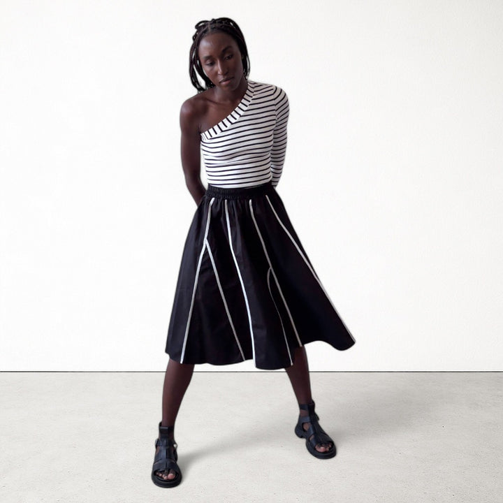Black skirt with panels and white contrast tape