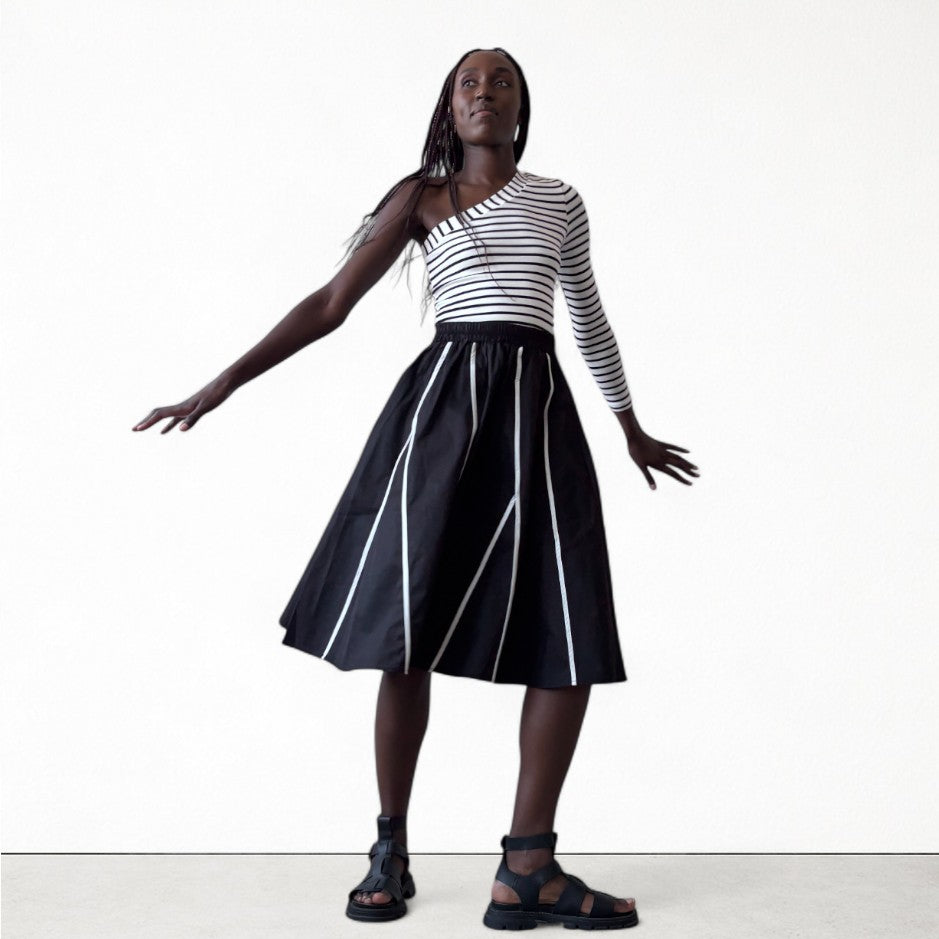Black skirt with panels and white contrast tape