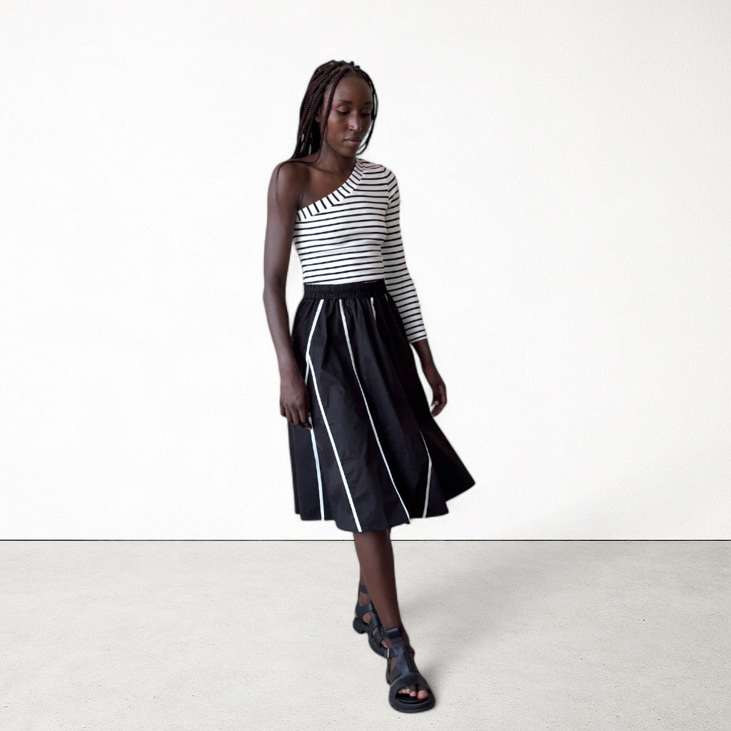 Black skirt with panels and white contrast tape