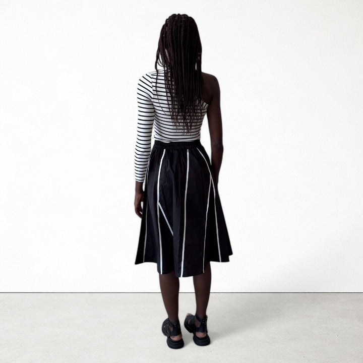 Black skirt with panels and white contrast tape