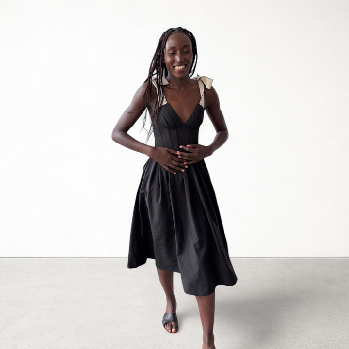 Black corset dress with contrasting trap ties