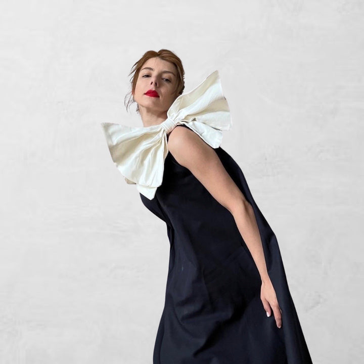 Navy cloche dress with one shoulder white bow