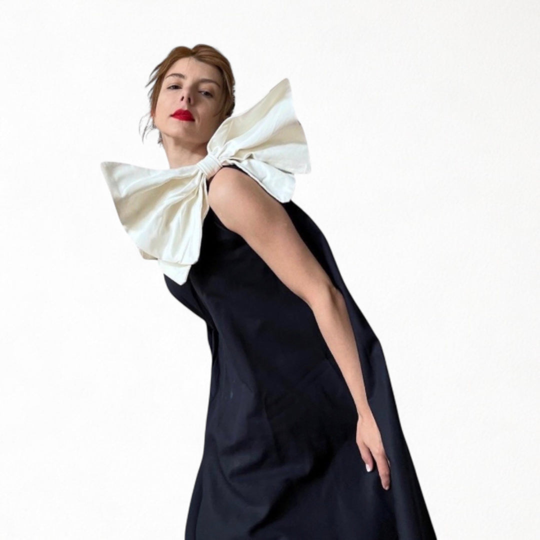 Navy cloche dress with one shoulder white bow