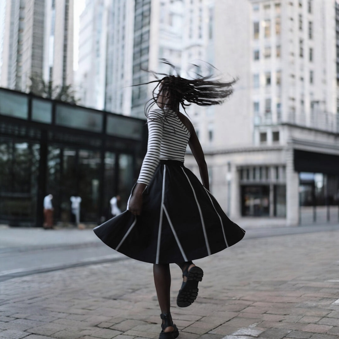 Black skirt with panels and white contrast tape