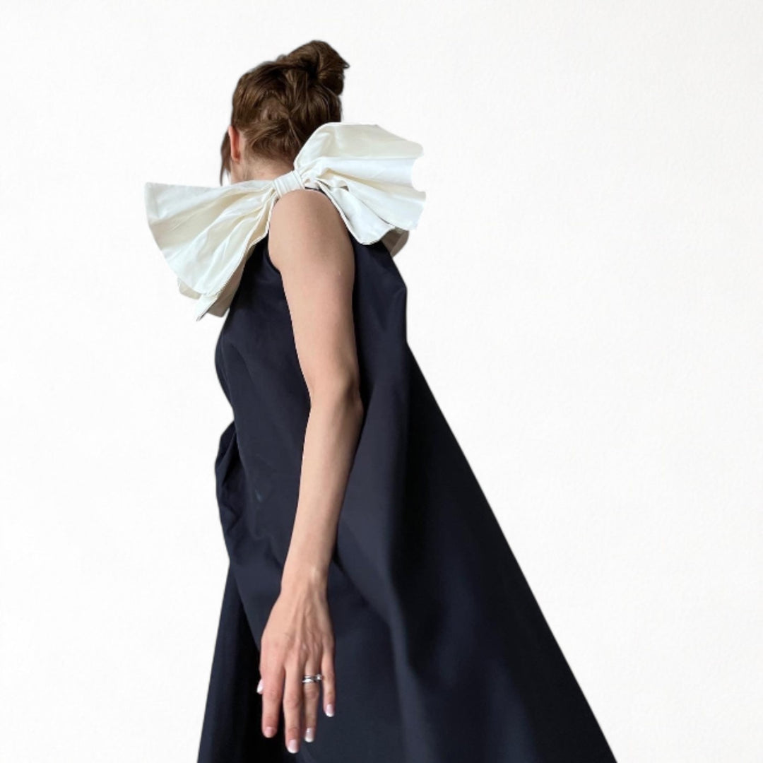 Navy cloche dress with one shoulder white bow