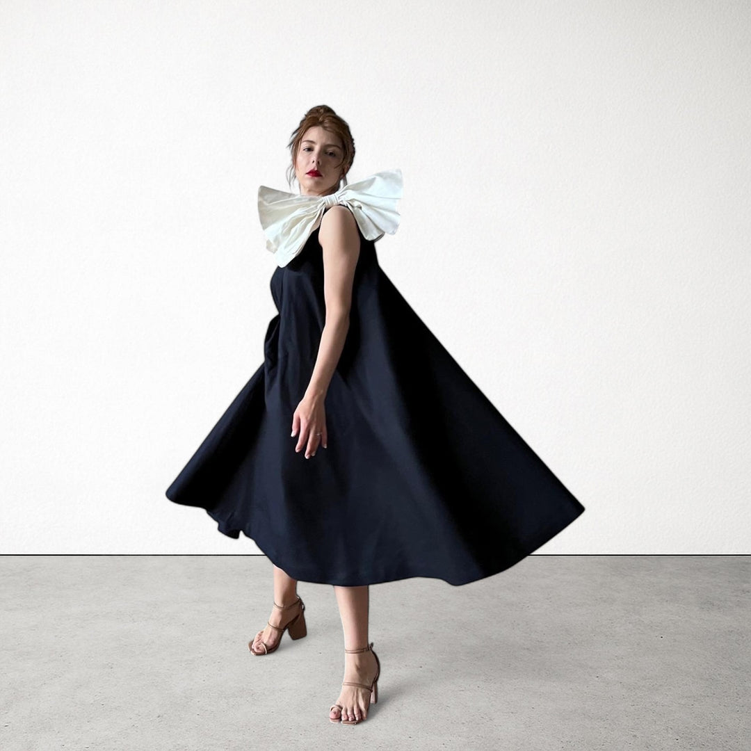 Navy cloche dress with one shoulder white bow