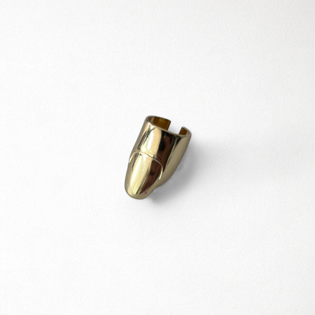 Gold finger cover with nail detail