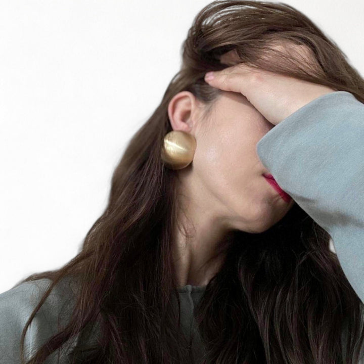 Big brushed gold stud earrings