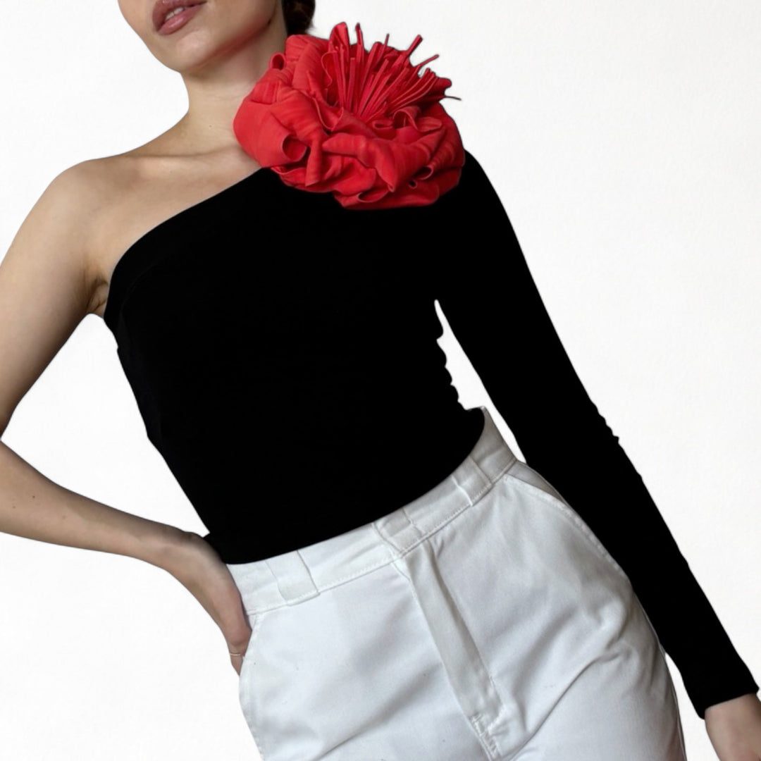 Black one sleeve top with red flower pin