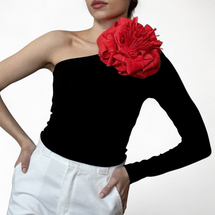 Black one sleeve top with red flower pin