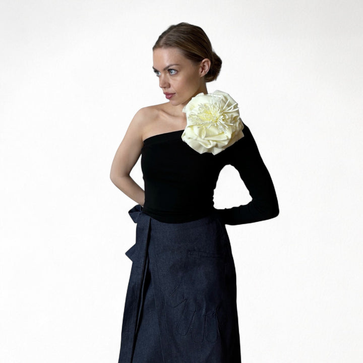 Black one sleeve top with white flower pin