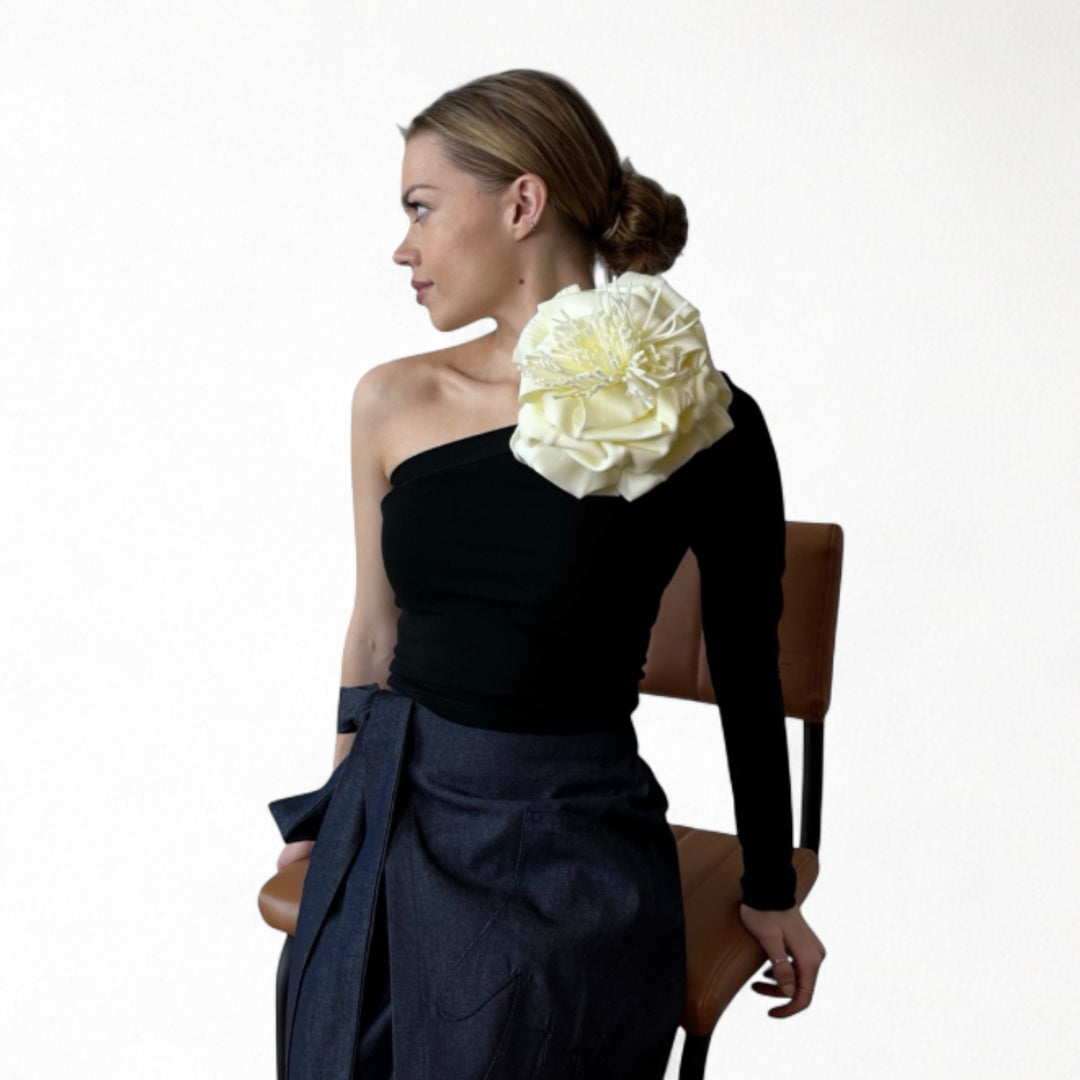 Black one sleeve top with white flower pin