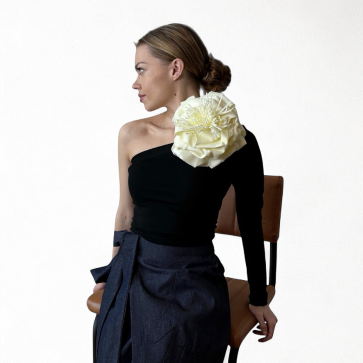 Black one sleeve top with white flower pin