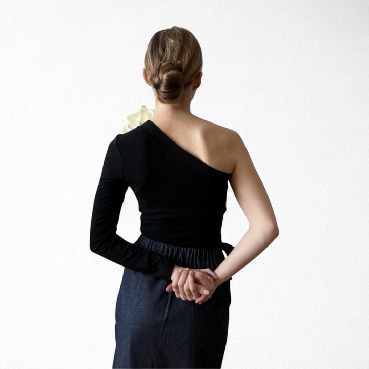 Black one sleeve top with red flower pin