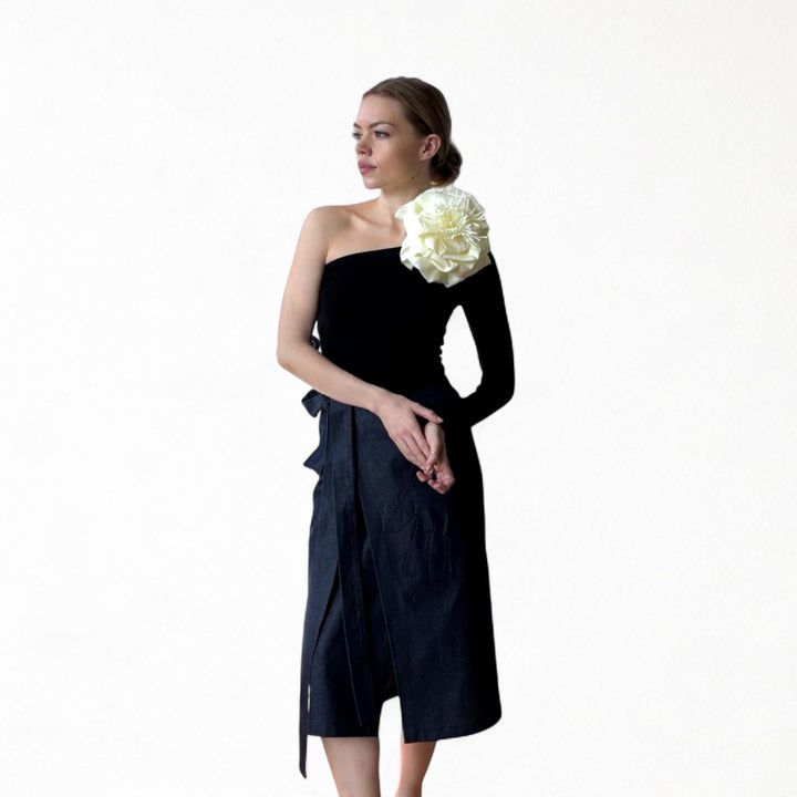 Black one sleeve top with white flower pin