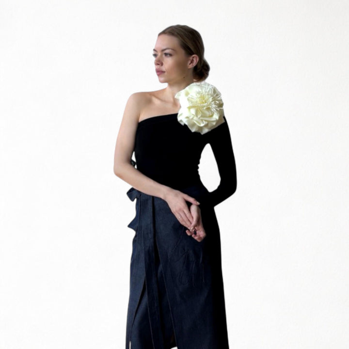 Black one sleeve top with white flower pin