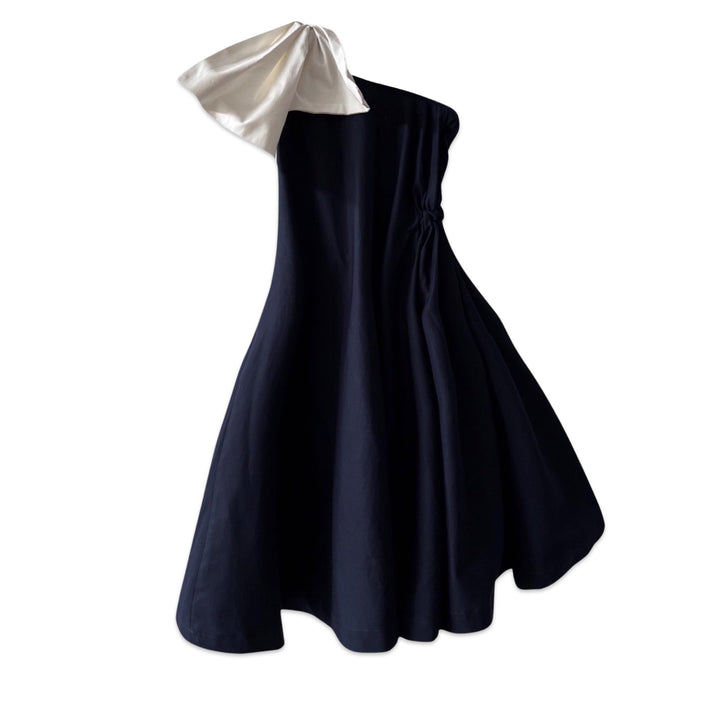 Navy cloche dress with one shoulder white bow