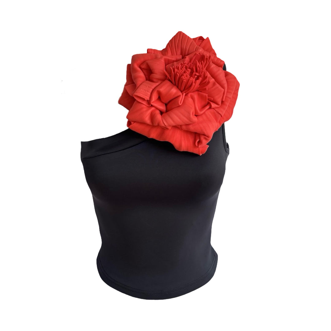 Black one shoulder top with red flower pin