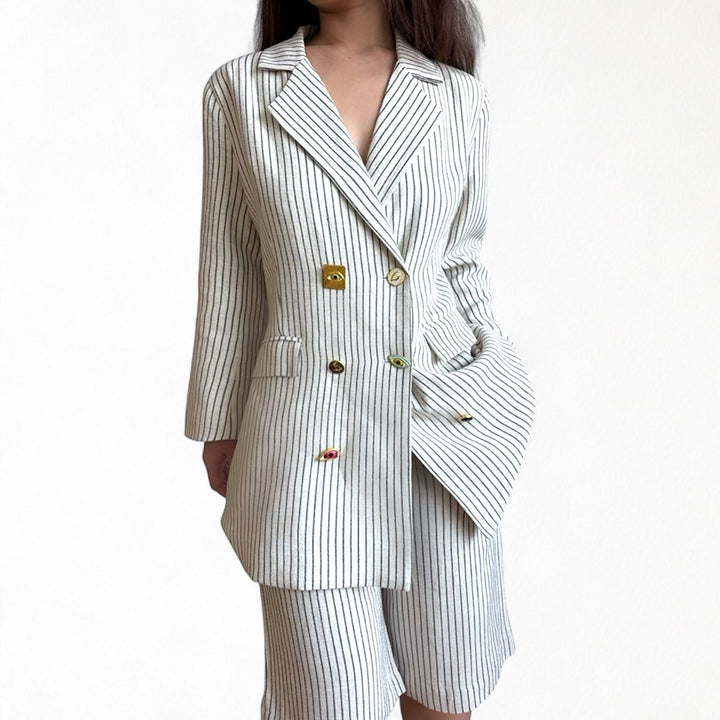 Ivory pin stripe linen double breasted suit with surrealist eye buttons