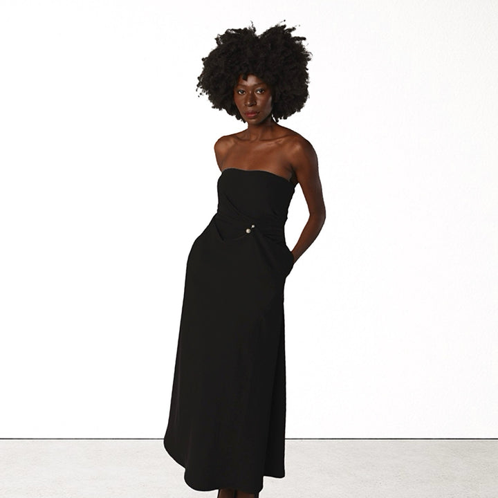 Black strapless dress with asymmetrical folds and pearl detail