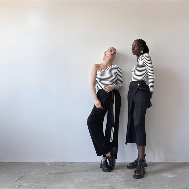 Black accordion pleated trousers with wrap detail