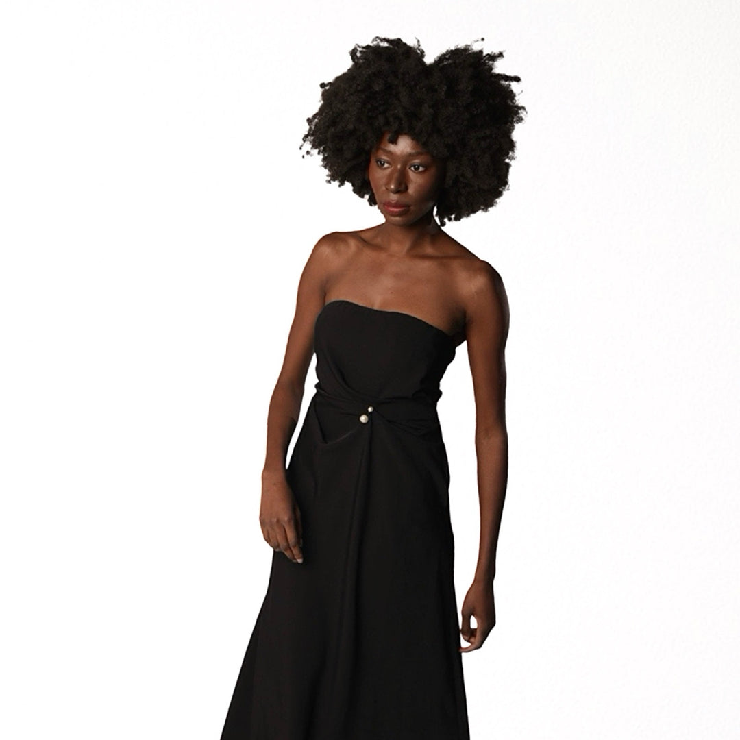 Black strapless dress with asymmetrical folds and pearl detail