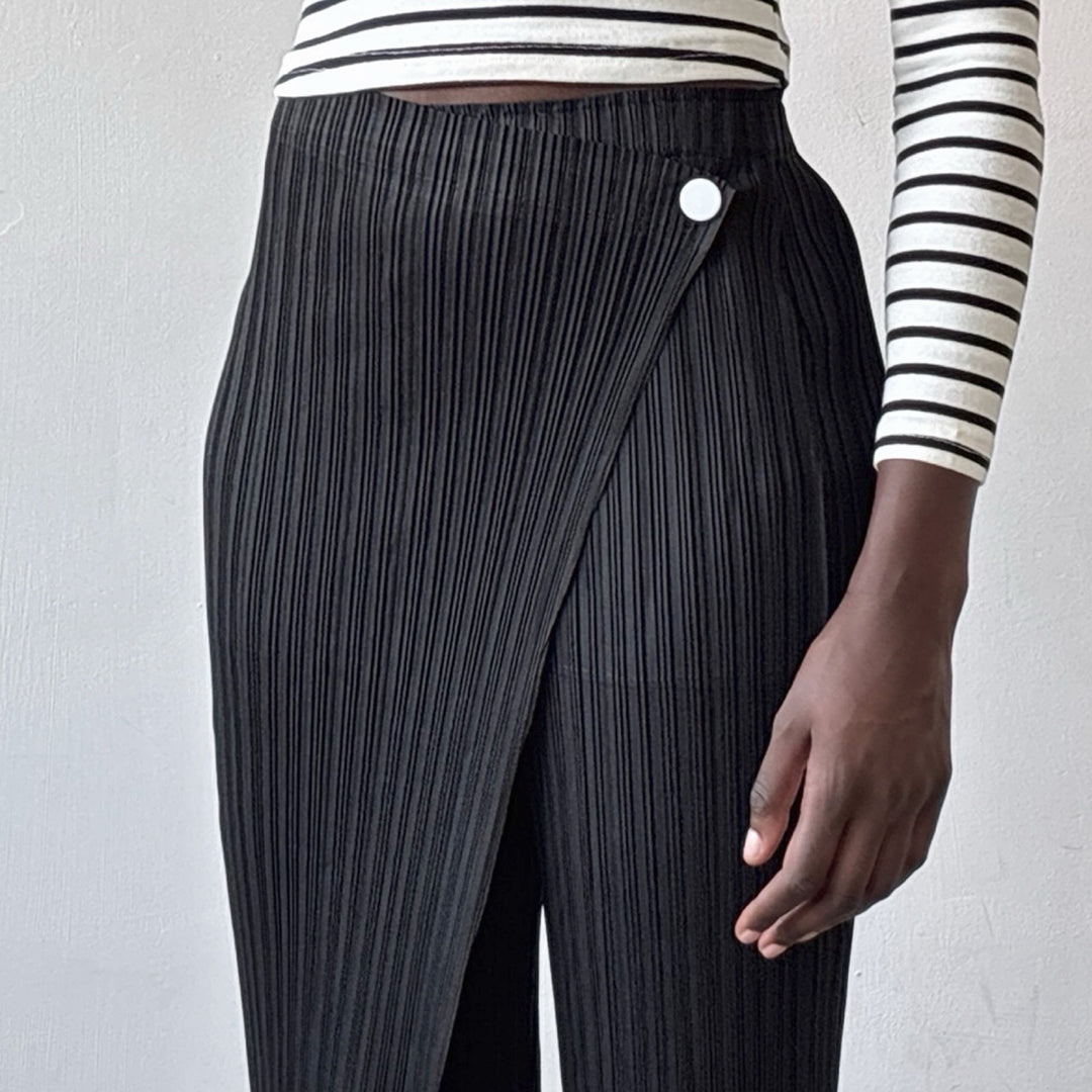 Black accordion pleated trousers with wrap detail
