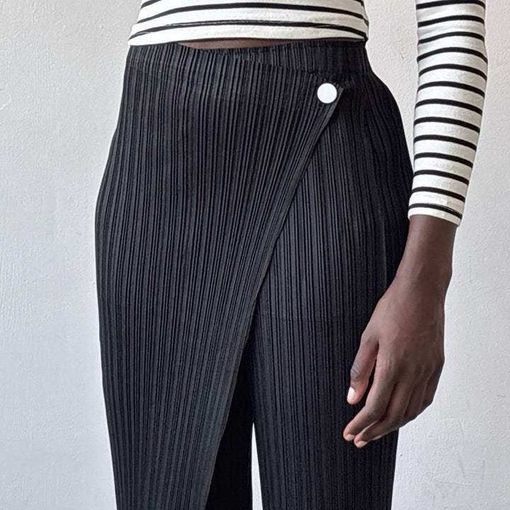 Black accordion pleated trousers with wrap detail