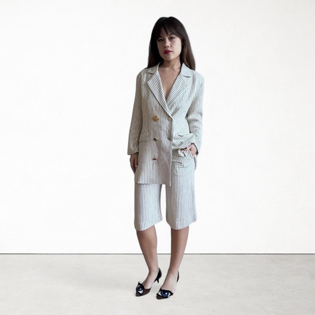 Ivory pin stripe linen double breasted suit with surrealist eye buttons