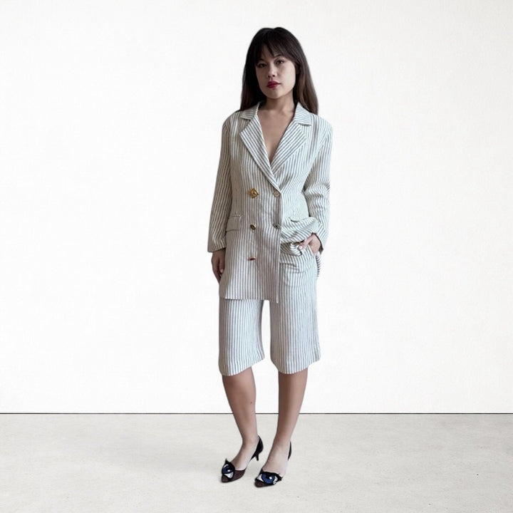 Ivory pin stripe linen double breasted suit with surrealist eye buttons