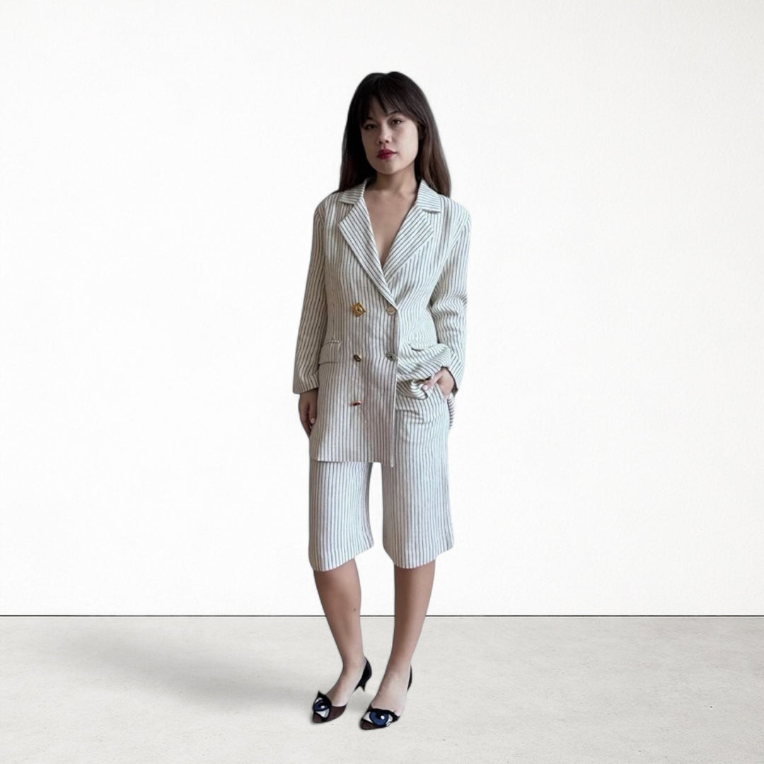 Ivory pin stripe linen double breasted suit with surrealist eye buttons