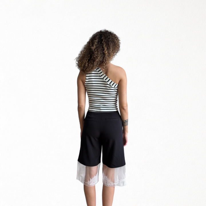 Striped one shoulder top with red flower pin