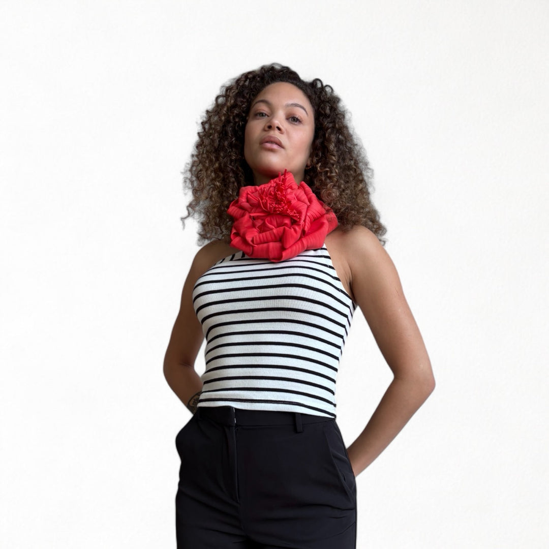 Striped one shoulder top with red flower pin