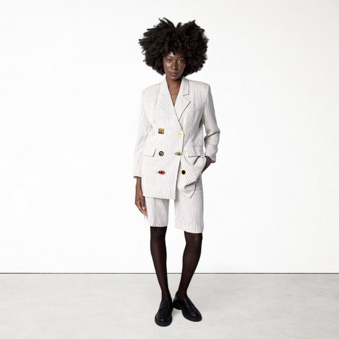 Ivory pin stripe linen double breasted suit with surrealist eye buttons