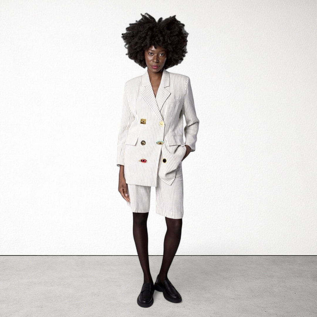 Ivory pin stripe linen double breasted suit with surrealist eye buttons