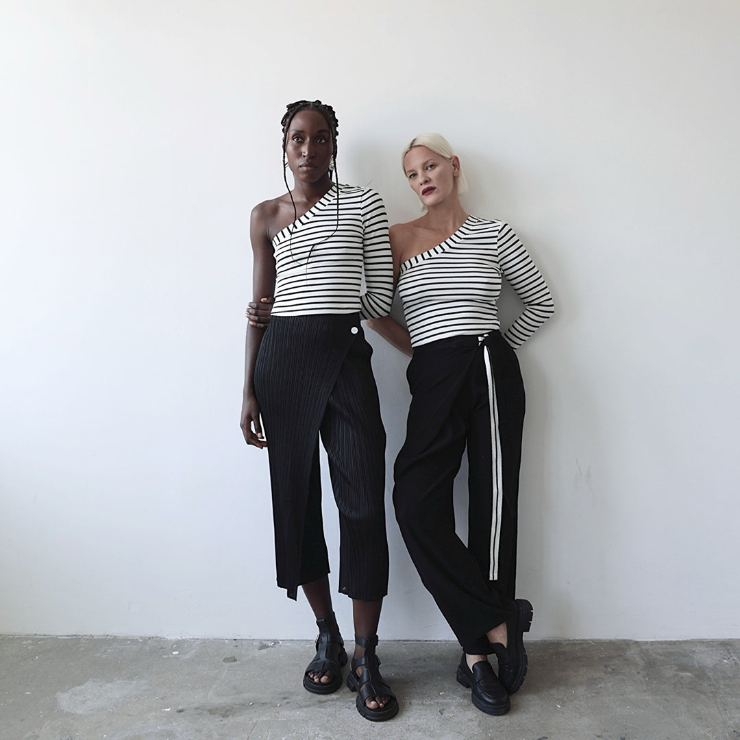 Black accordion pleated trousers with wrap detail