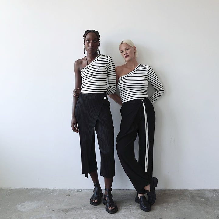 Black accordion pleated trousers with wrap detail