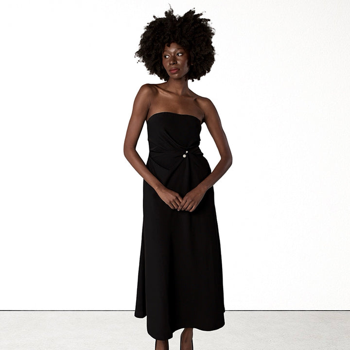 Black strapless dress with asymmetrical folds and pearl detail
