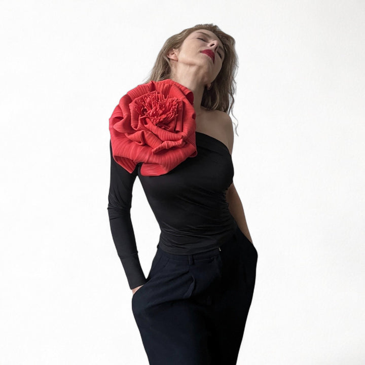 Black one sleeve top with red flower pin
