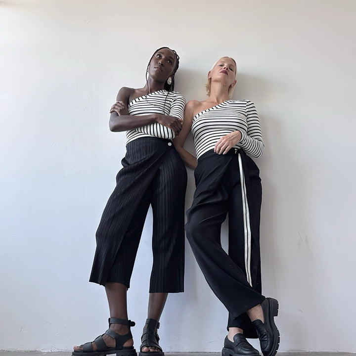 Black accordion pleated trousers with wrap detail