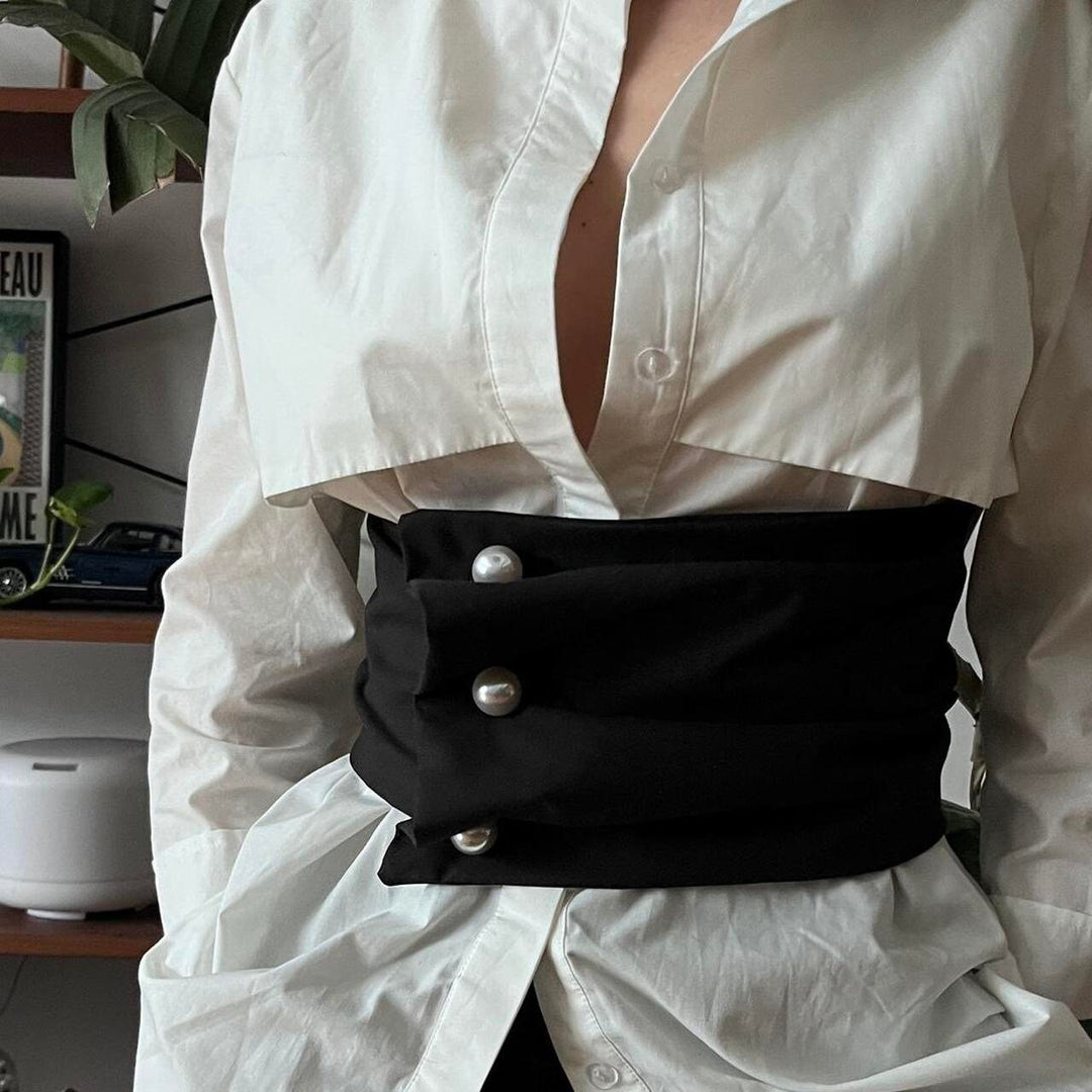 Black wide asymmetrical belt with pearl buttons