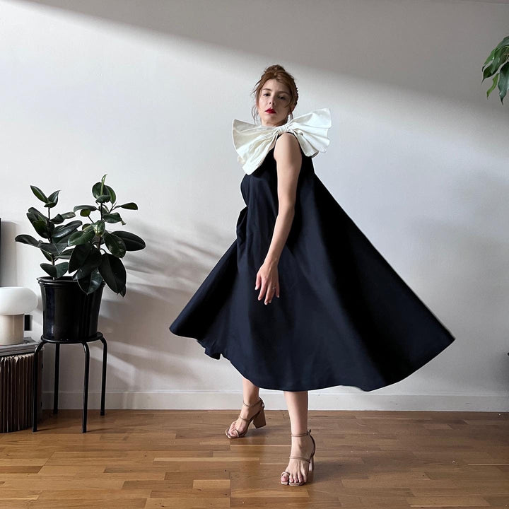 Navy cloche dress with one shoulder white bow